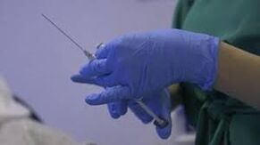 Injection in the hands of a doctor